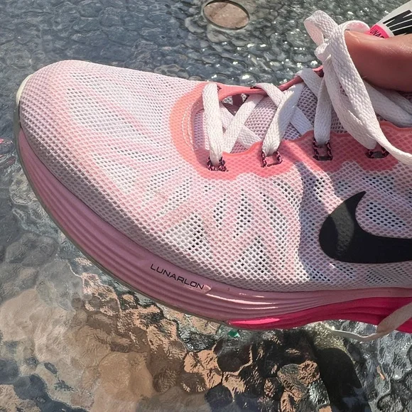 Nike Women's Pink, White and Black athletic sneakers. - Picture 13 of 17